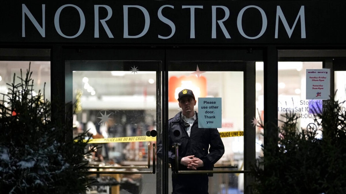 An officer stands inside Nordstrom at Mall of America