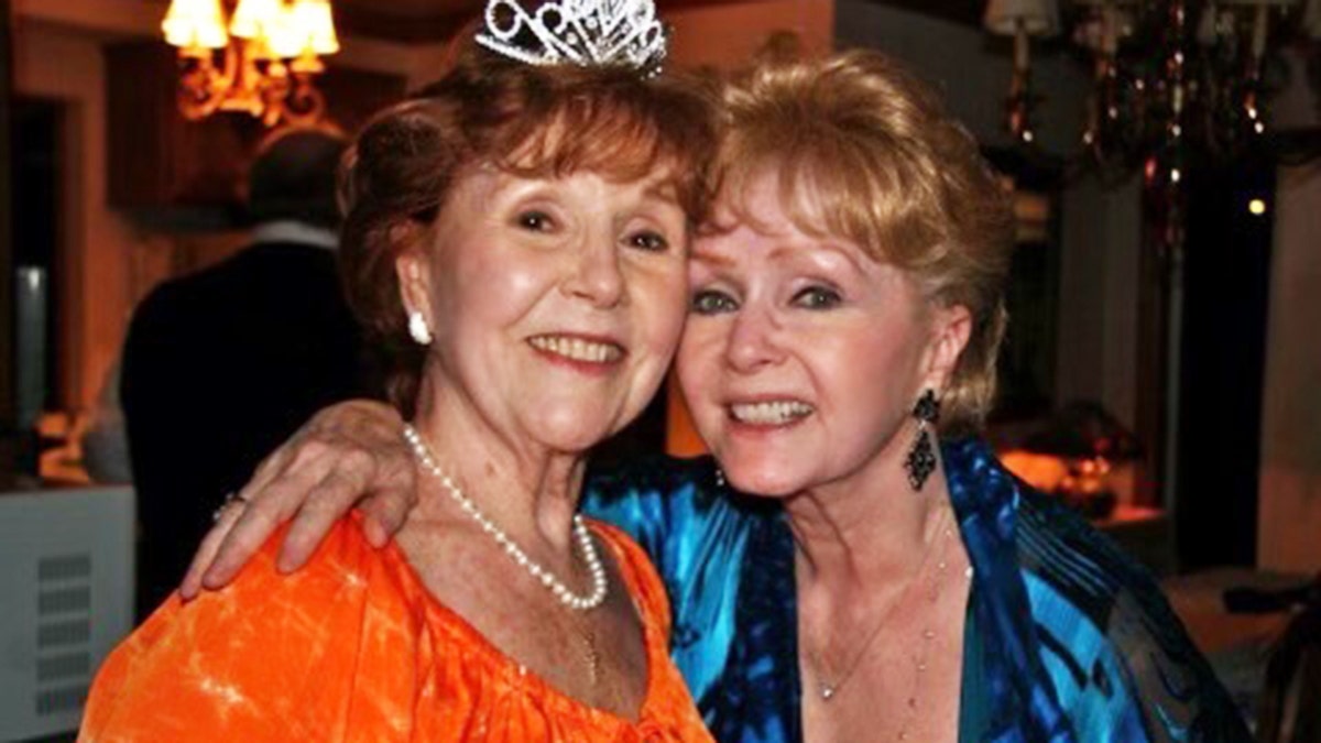 Margie Duncan and Debbie Reynolds embracing each other in the later years