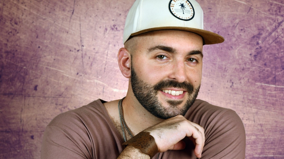 Matthew Grech wearing ball cap