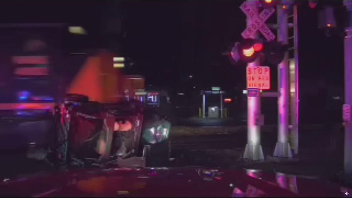 train striking car
