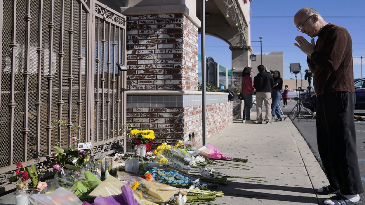 Kenny Loo, 71, prays outside Star Ballroom Dance Studio for the victims killed in Saturday's shooting in Monterey Park, California, on Monday, Jan. 23.