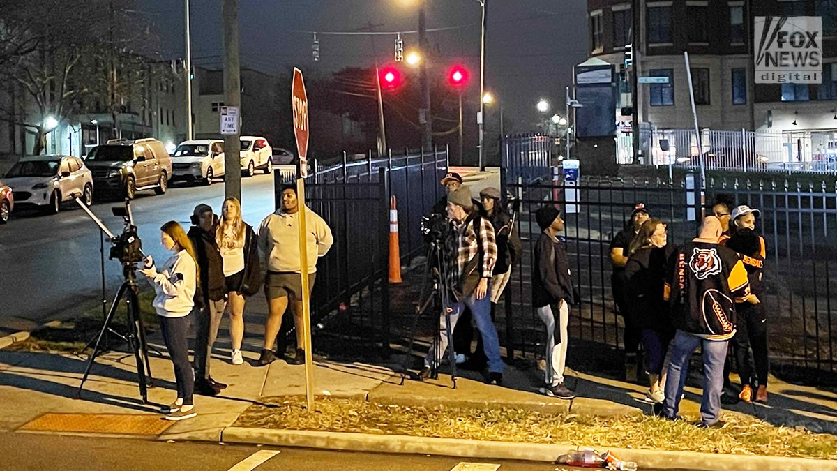 Fans and press gather outside Cincinnati hospital