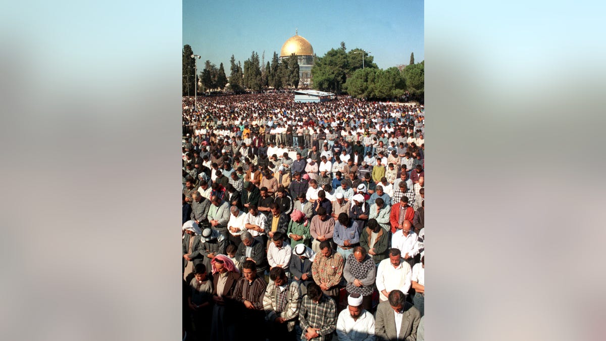 Muslim prayer outside Al Aqsa Mosque