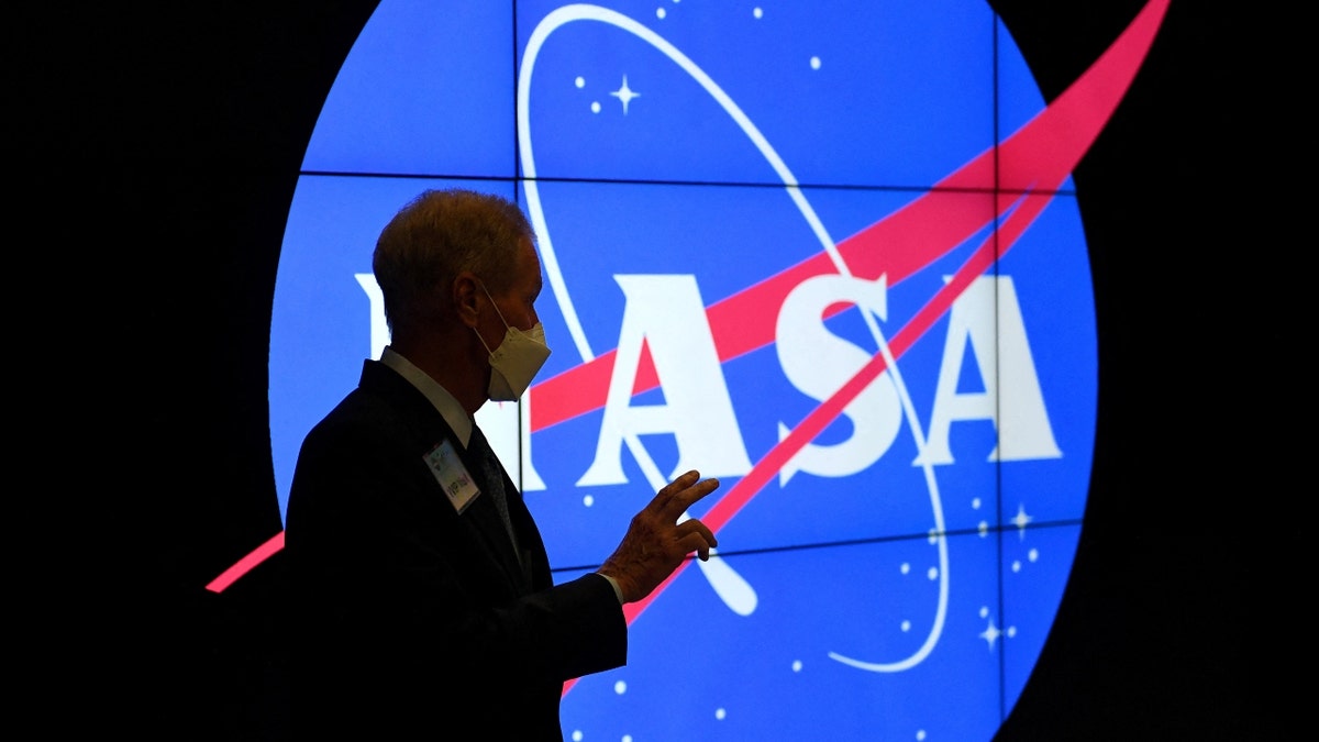 NASA logo and man