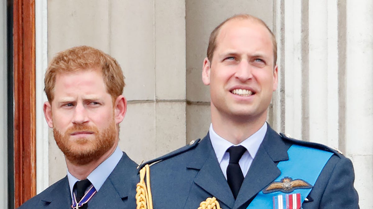 Prince Harry standing by Prince William