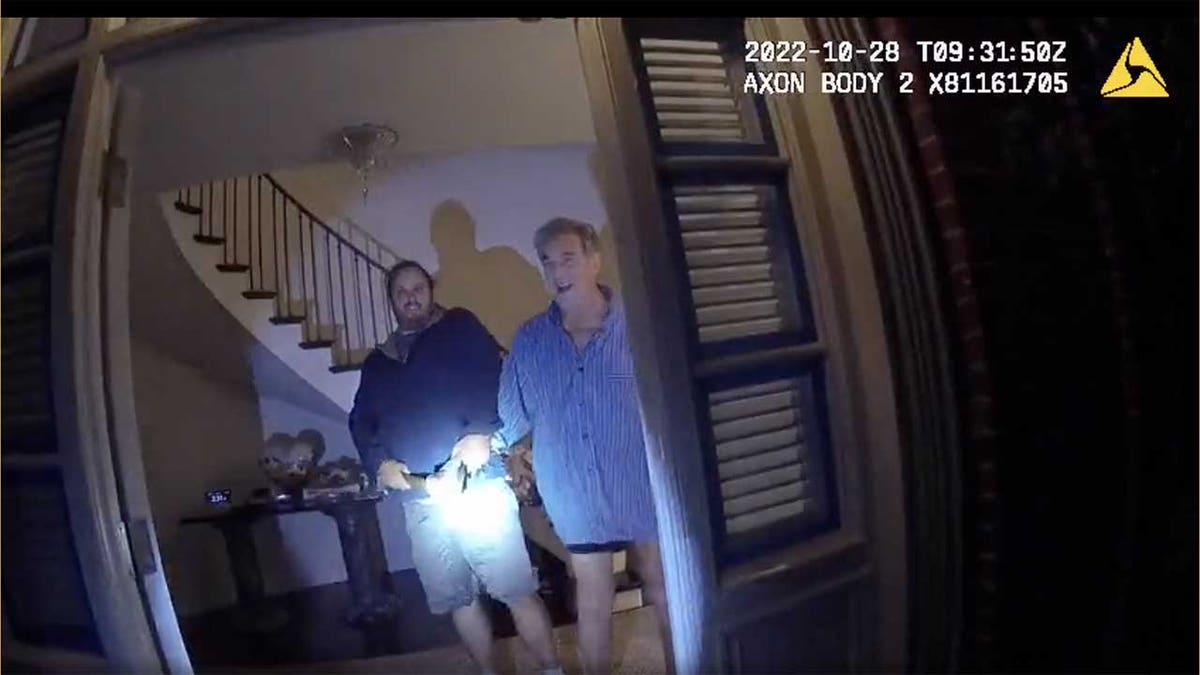 Body cam footage shows two at the door to a home