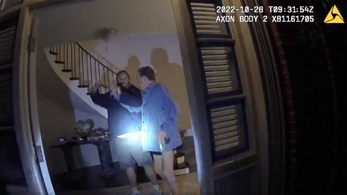Body cam footage shows two men struggling