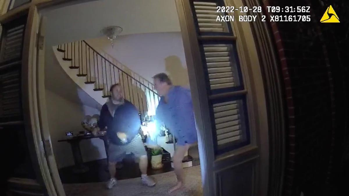 Body cam footage shows two men struggling