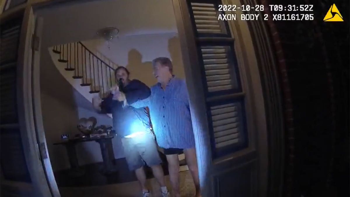 Body cam footage shows two men struggling