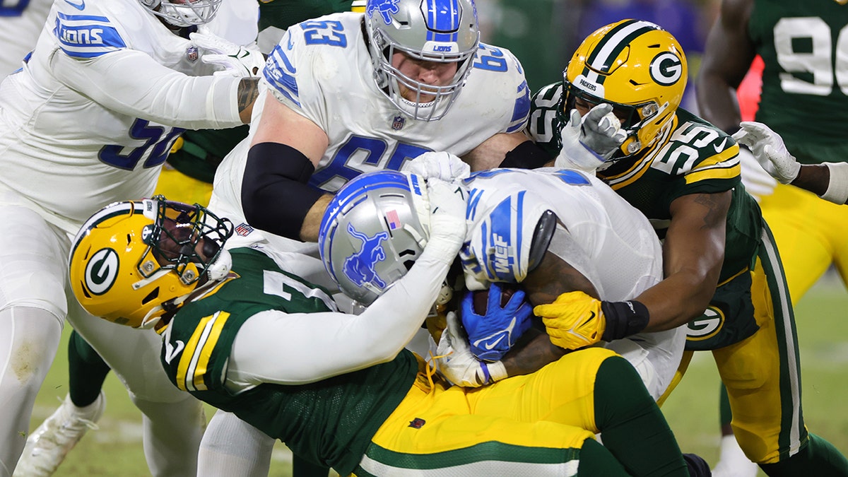 GREEN BAY, WI - JANUARY 08: Green Bay Packers linebacker Quay Walker (7)  celebrates during a game between the Green Bay Packers and the Detroit Lions  at Lambeau Field on January 8