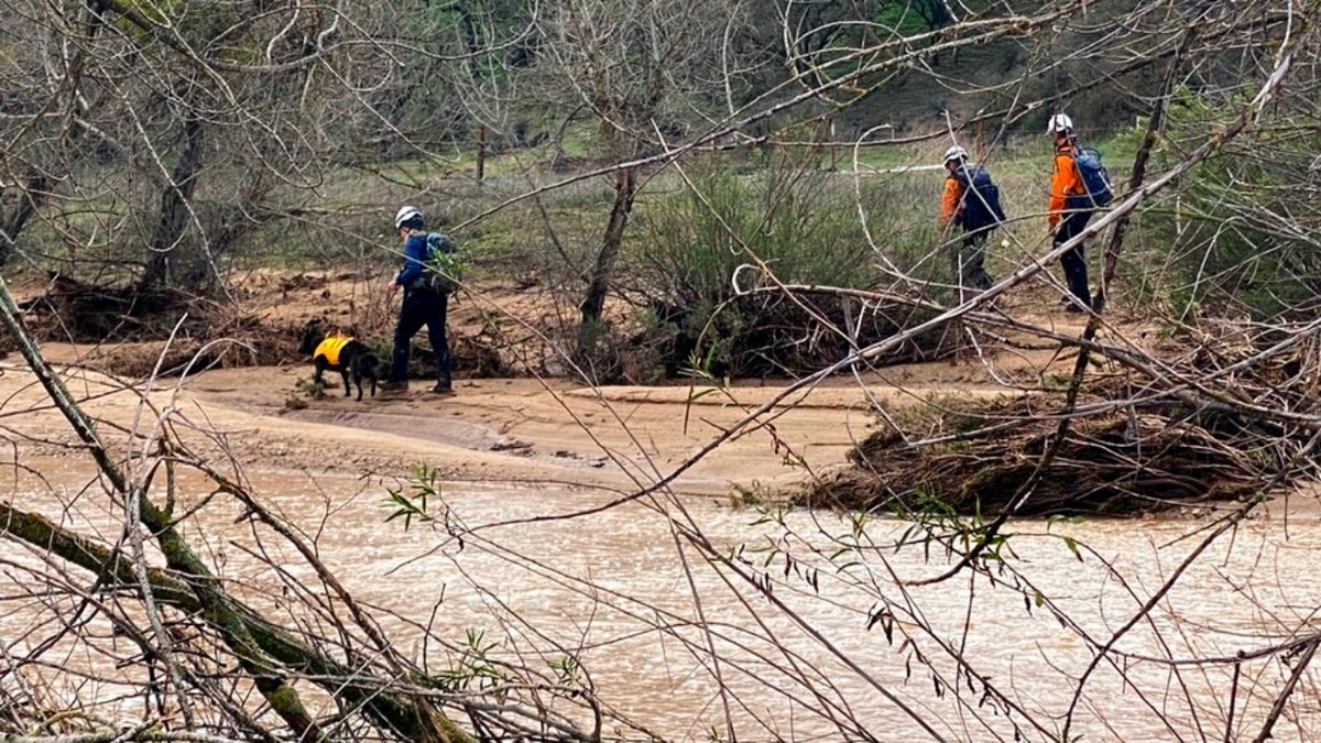 Authorities search in floodwaters
