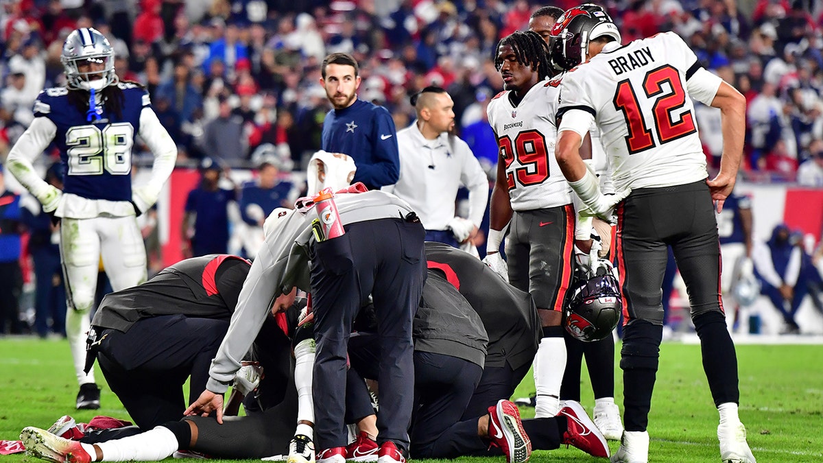 Tom Brady looks at Russell Gage