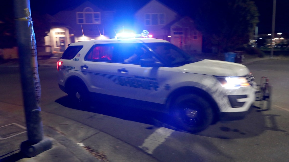 A Sonoma County Sheriff's Office police car speeds ahead