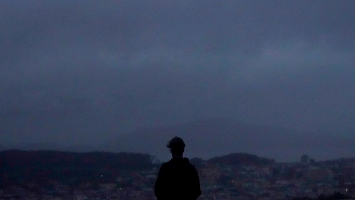 A person looks north from Grand View Park in San Francisco