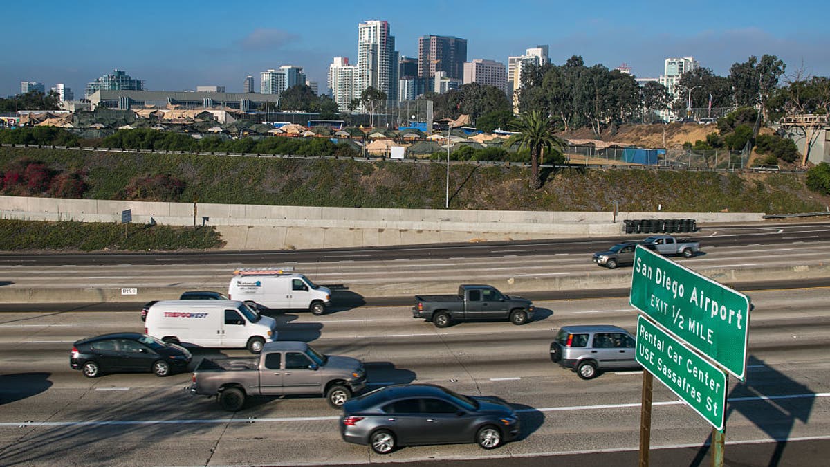 San Diego freeway with city skyline in background