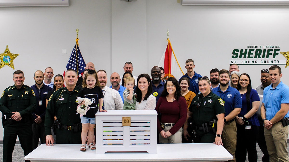 Kirsten Bridegan poses with Sheriff Robert Hardwick.