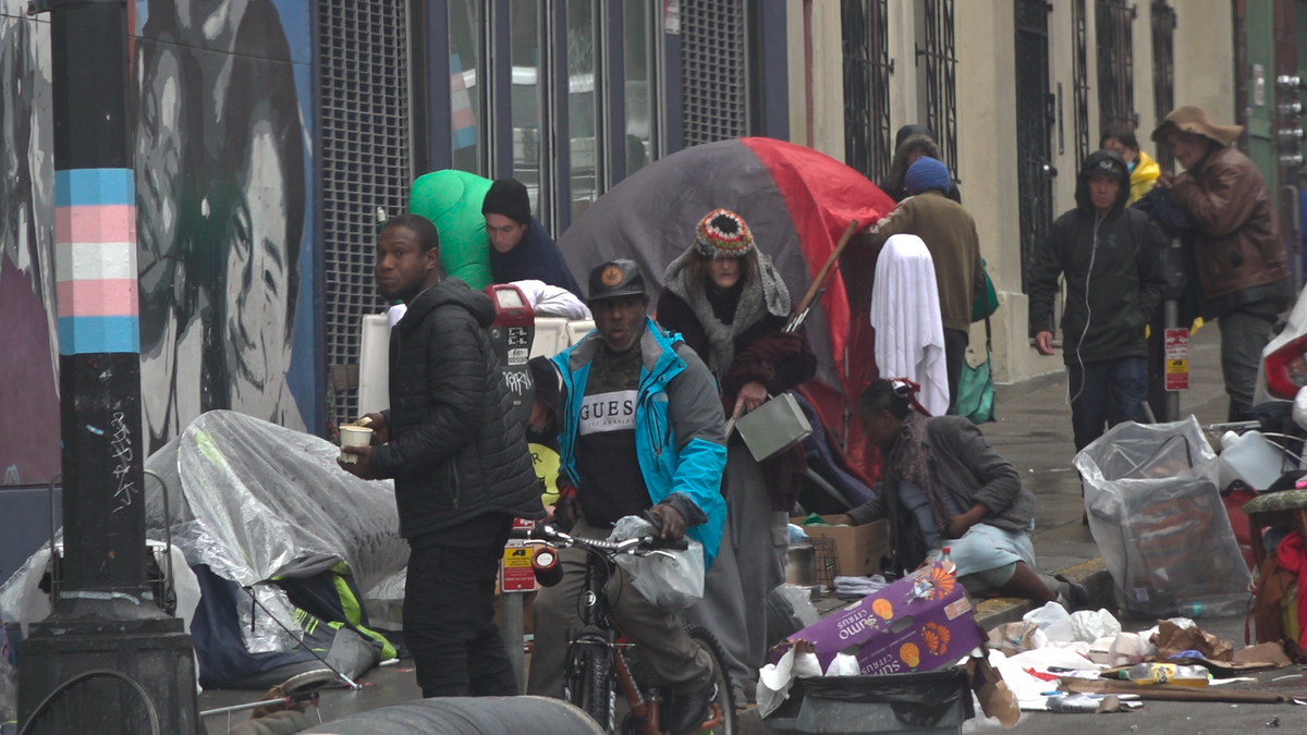 Tents and people along a street in San Francsico