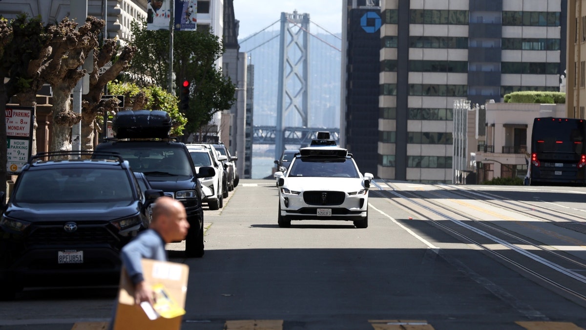 A Waymo autonomous vehicle drives in San Francisco, Calif.