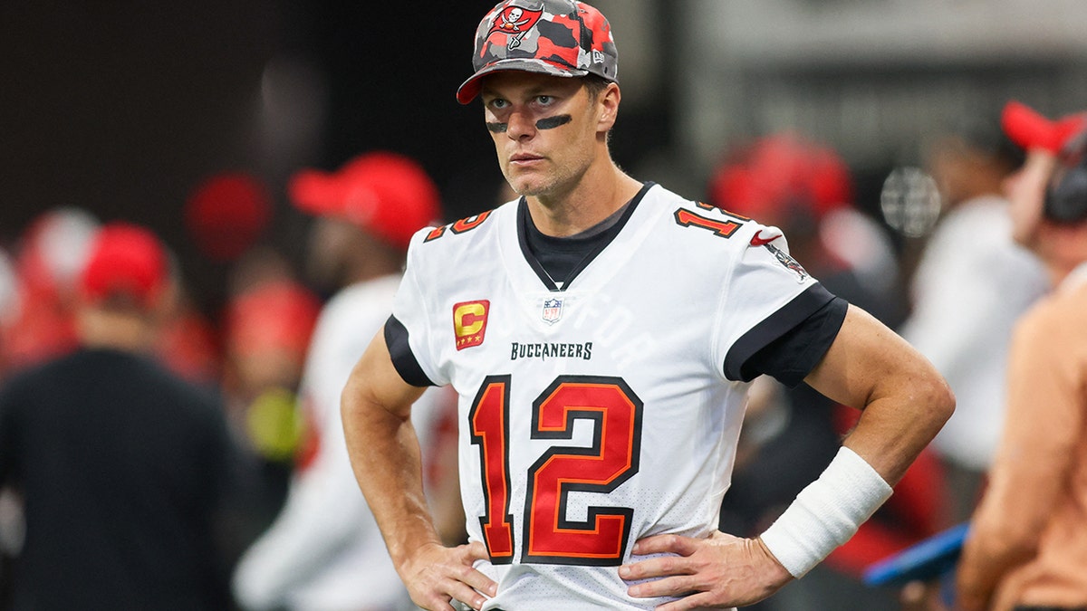 Tom Brady looks on the sideline