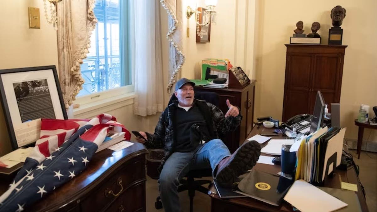 Bigo with his feet up on Nancy Pelosi's desk