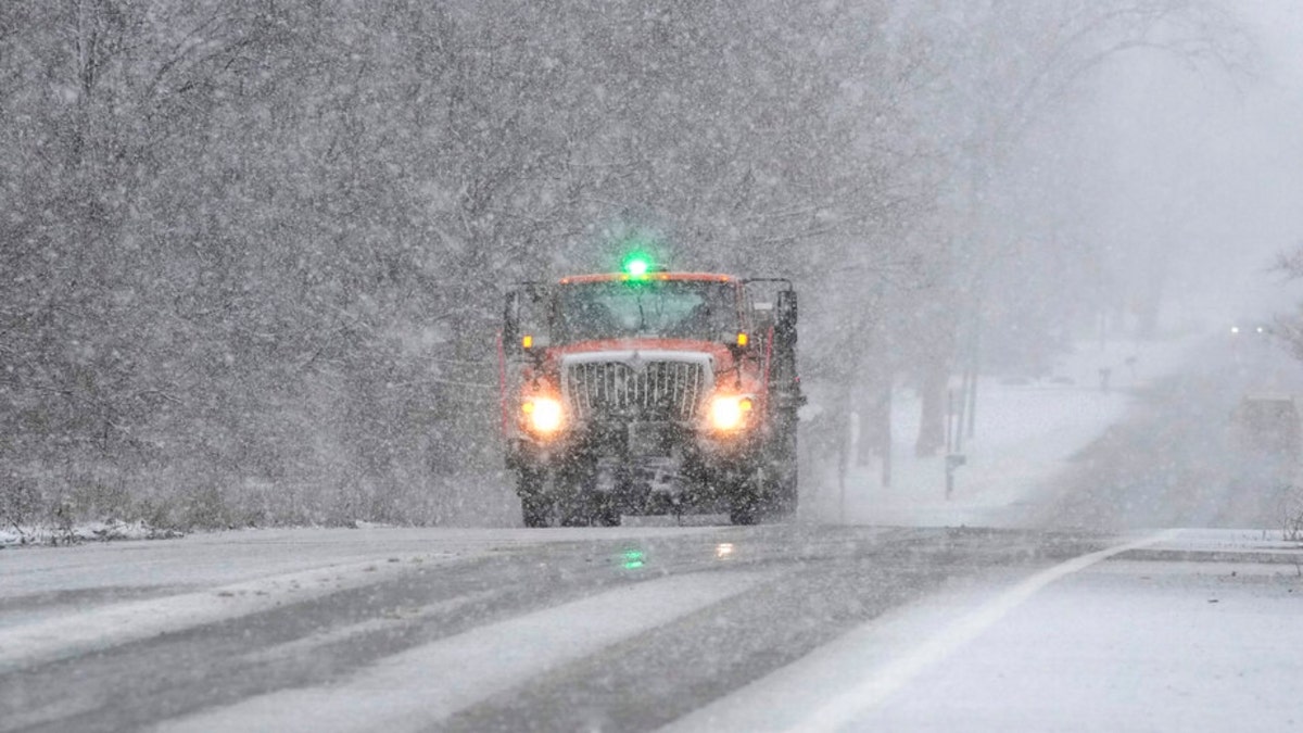 A Wayne County Department of Public Services truck salts a road in Michigan