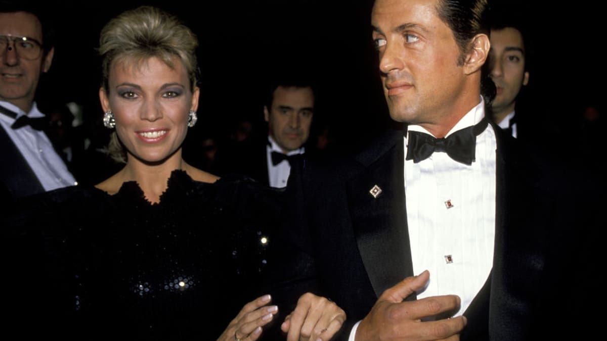 Sylvester Stallone and Vanna White at an event