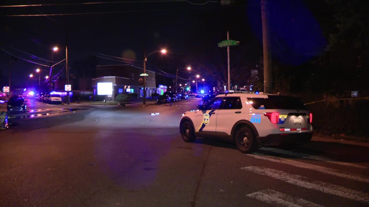 police cruiser at intersection of quadruple shooting