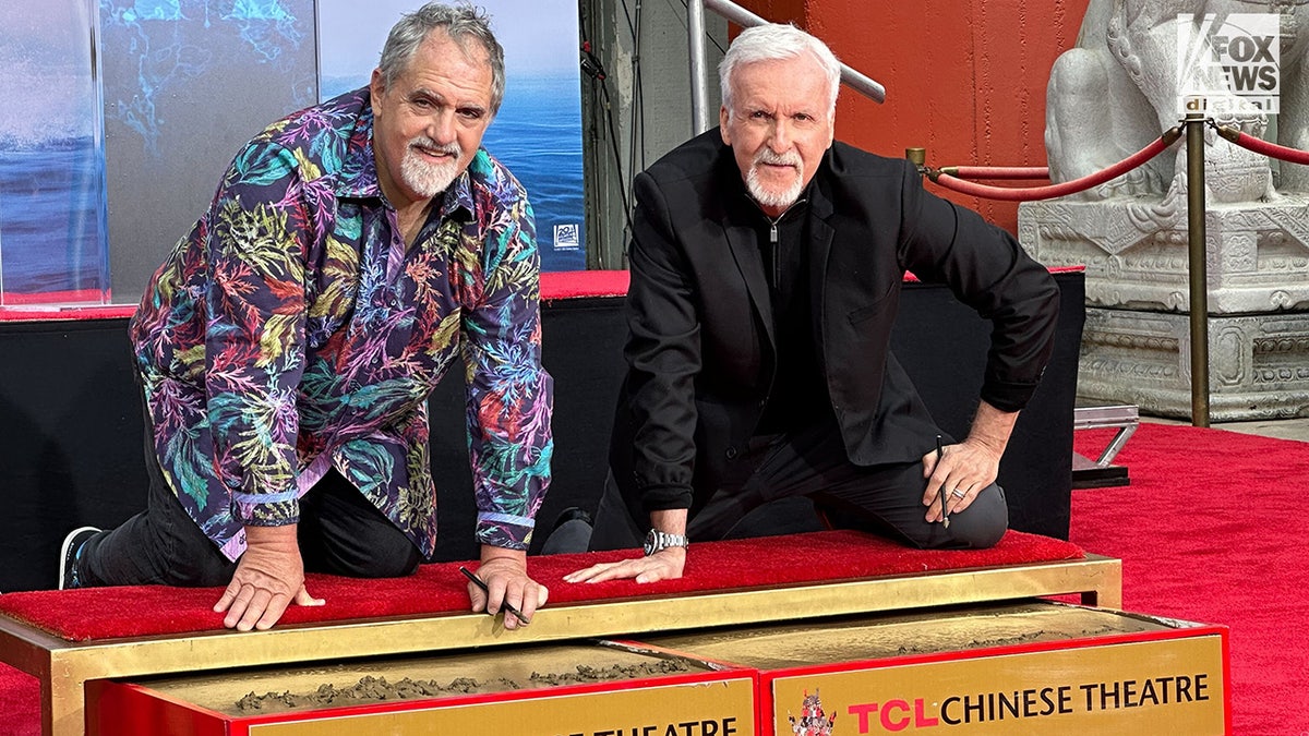 James Cameron and Jon Landau in front of TLC Theater