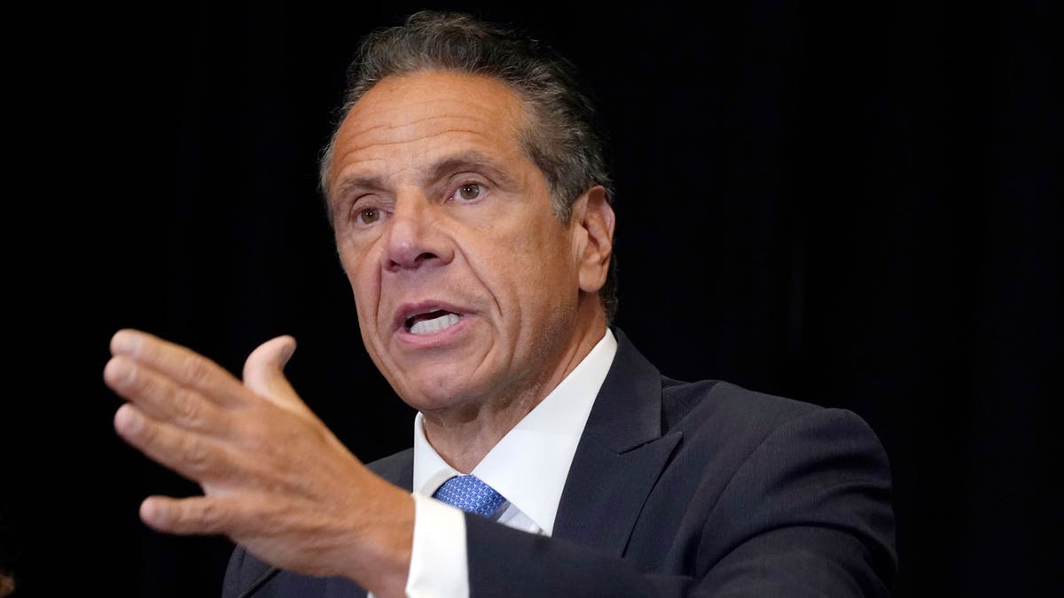 Andrew Cuomo with his hand outstretched