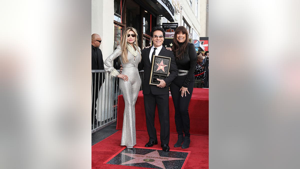 La Toya Jackson, Andy Madadian,and Anita Pointer stand side by side on red carpet