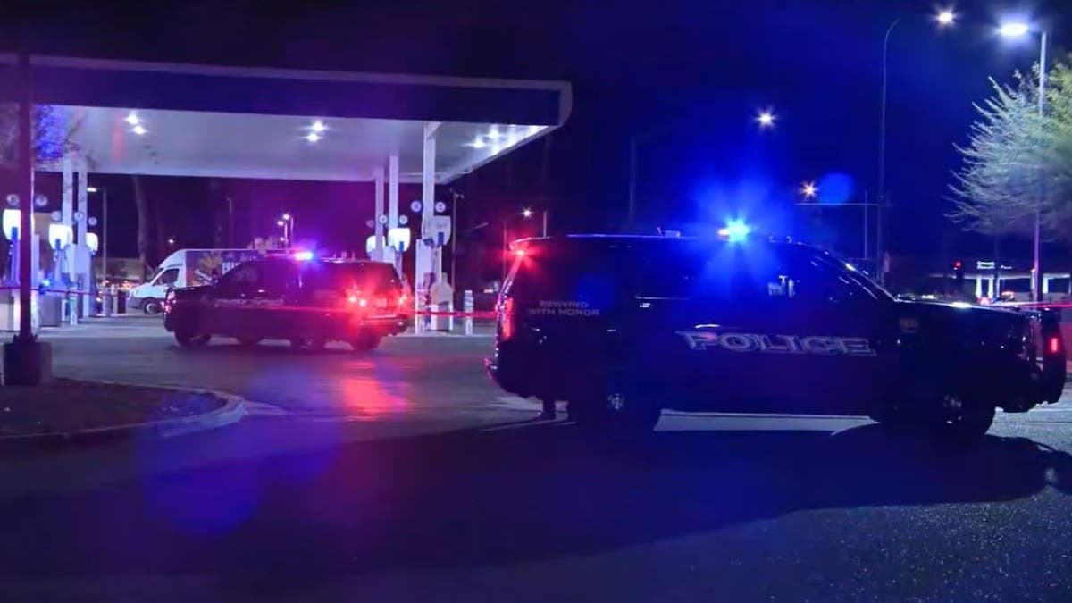 Police at gas station where robbery suspect was shot