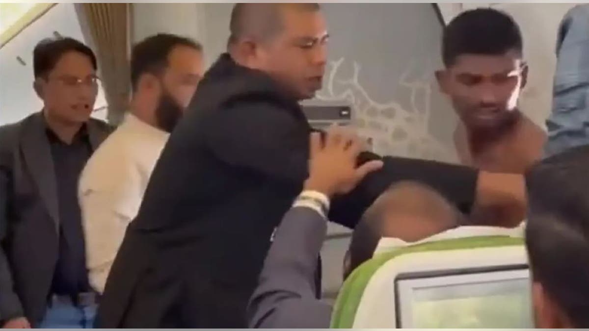 Passengers breaking up fight