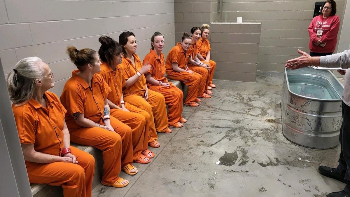 Female inmates getting baptized at Decatur County Jail