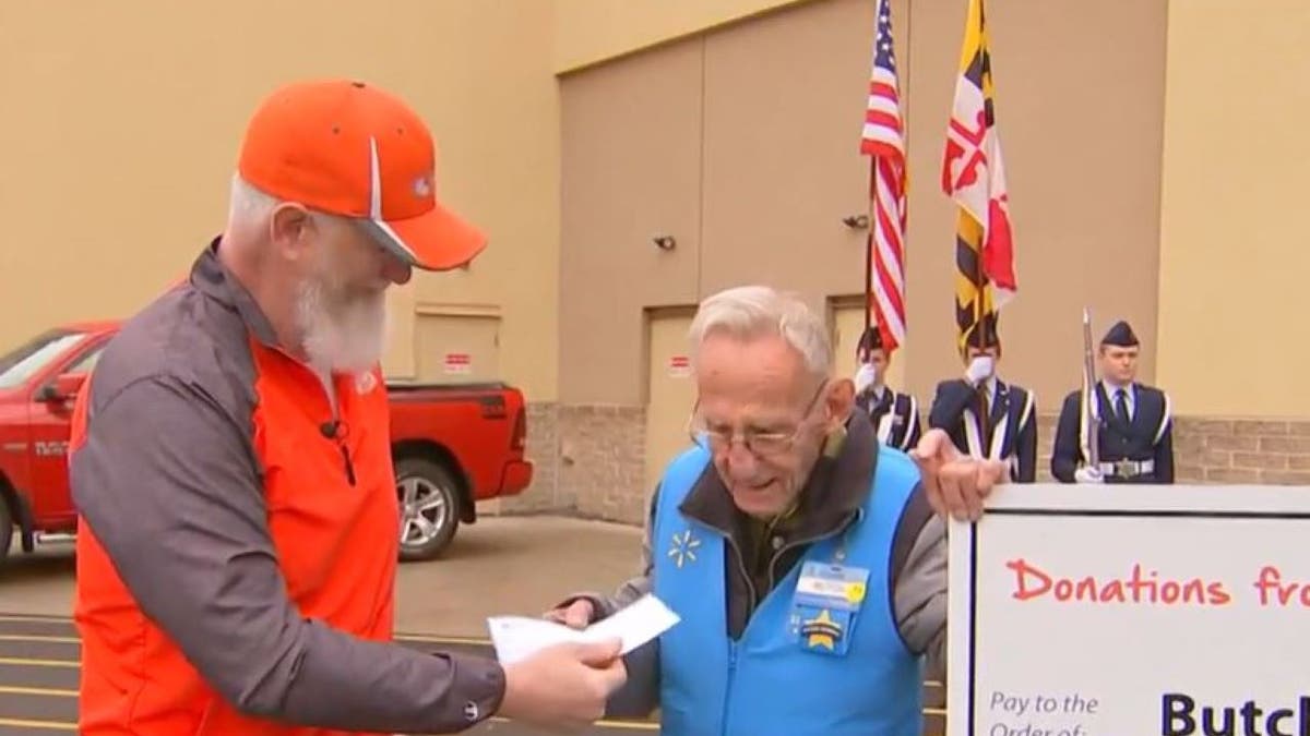 Butch Marion receiving check