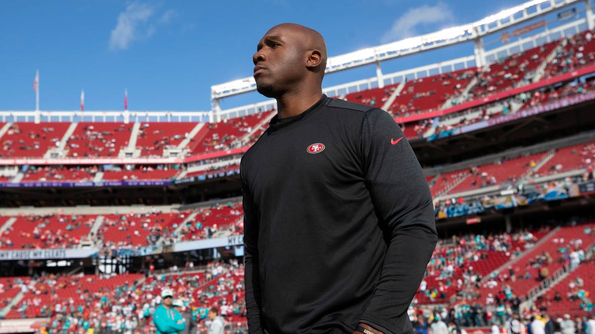 DeMeco Ryans watches pre-game