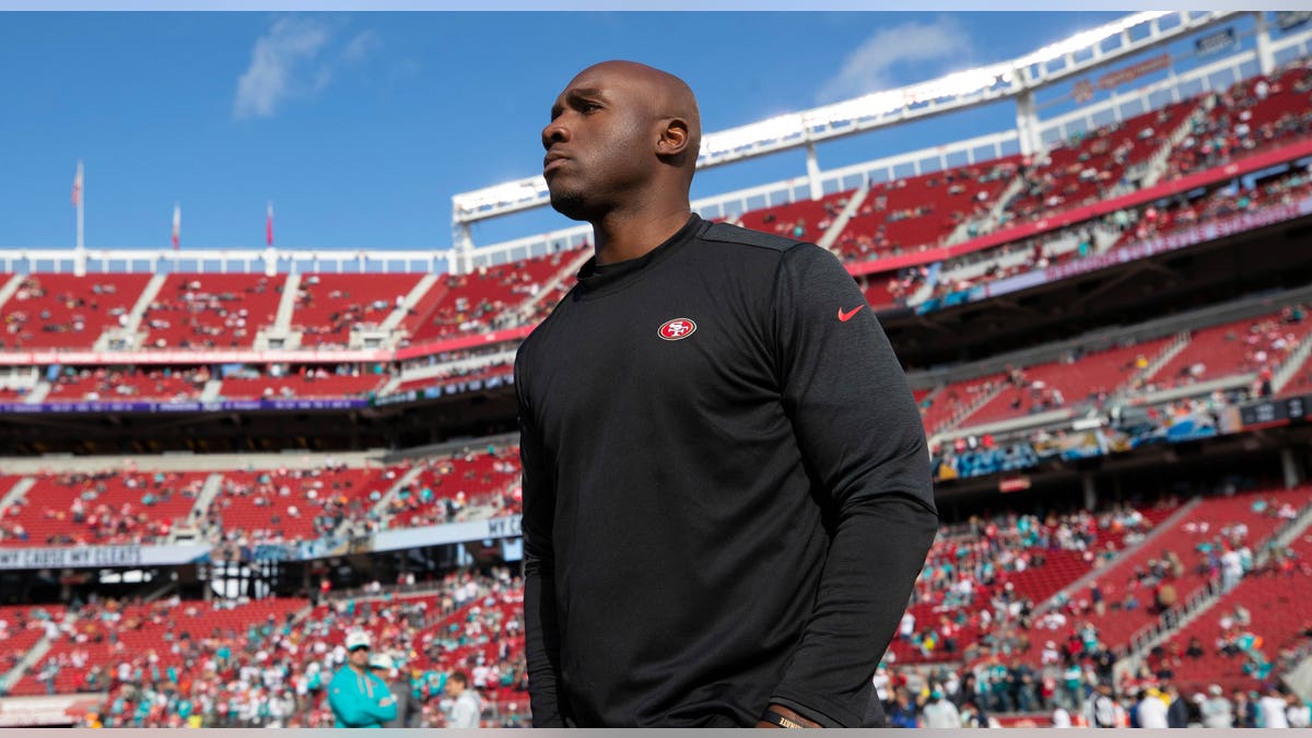 DeMeco Ryans watches pre-game