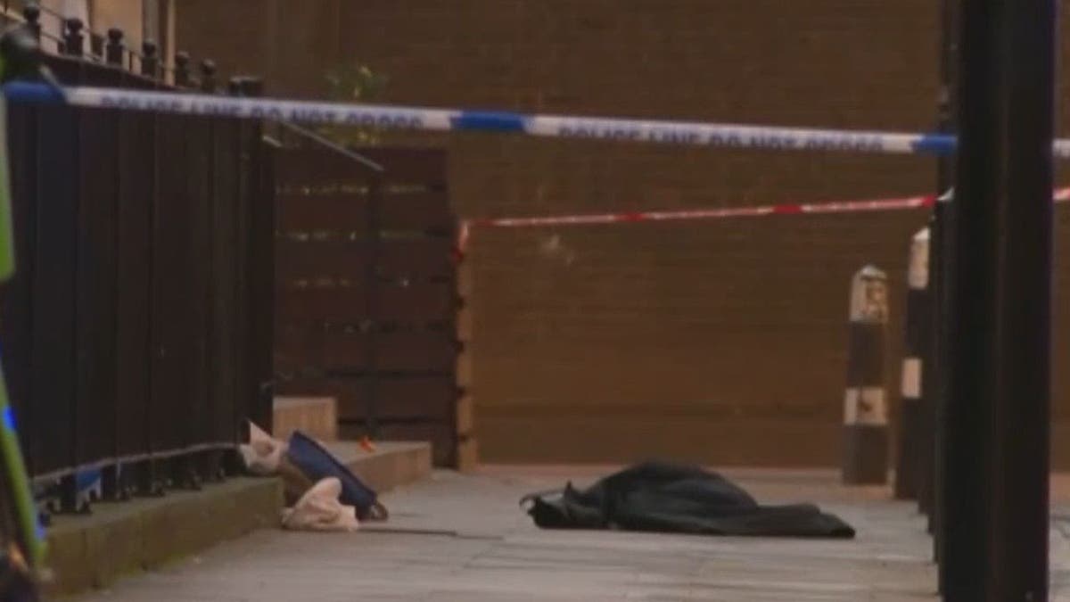Metropolitan Police secure the scene after a drive by shooting