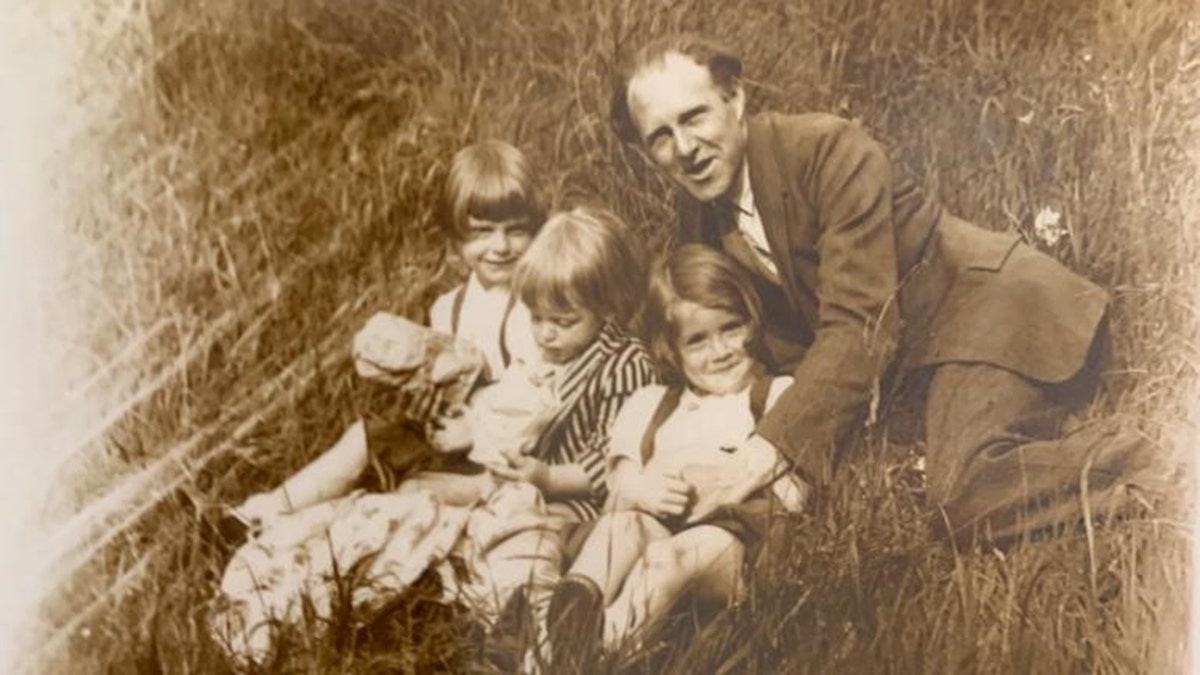 George Bourlet and his children are shown in this picture from decades ago.