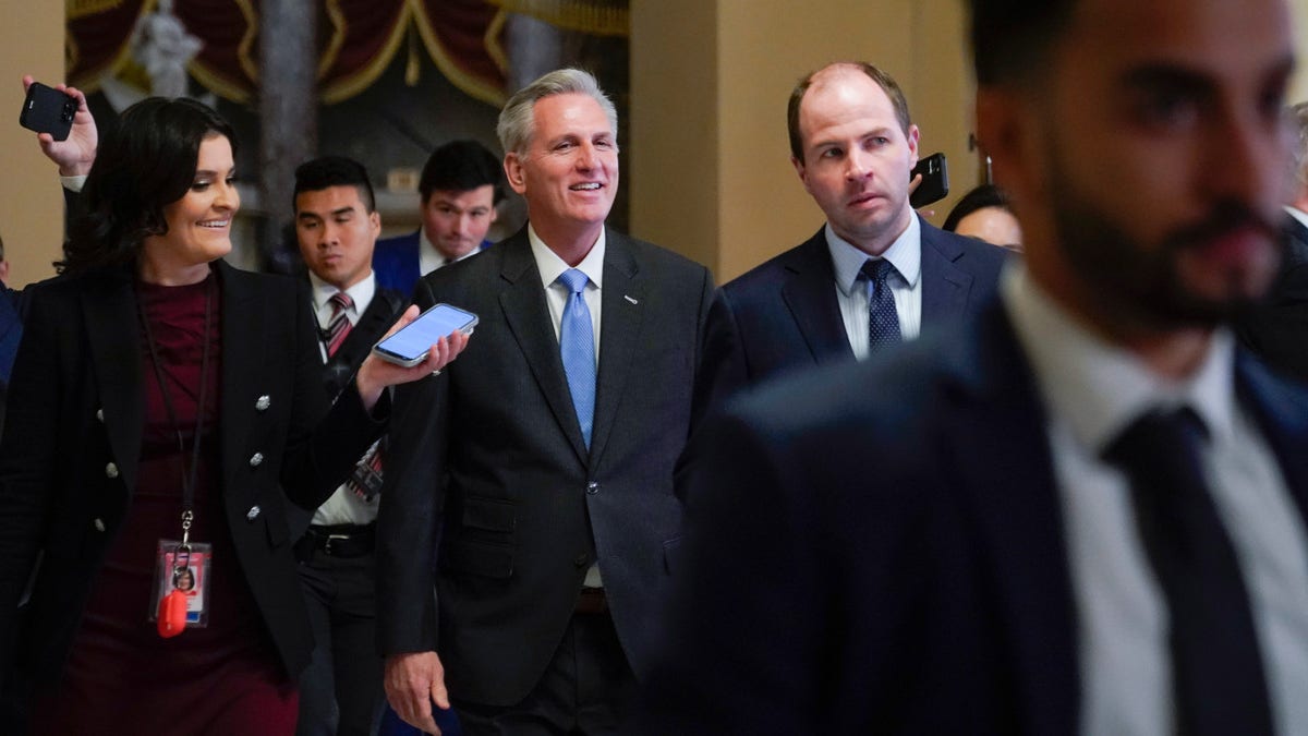 House Speaker Kevin McCarthy of Calif., speaks with members of the press as he walks to the House floor on Capitol Hill in Washington, Wednesday, Jan. 11, 2023.