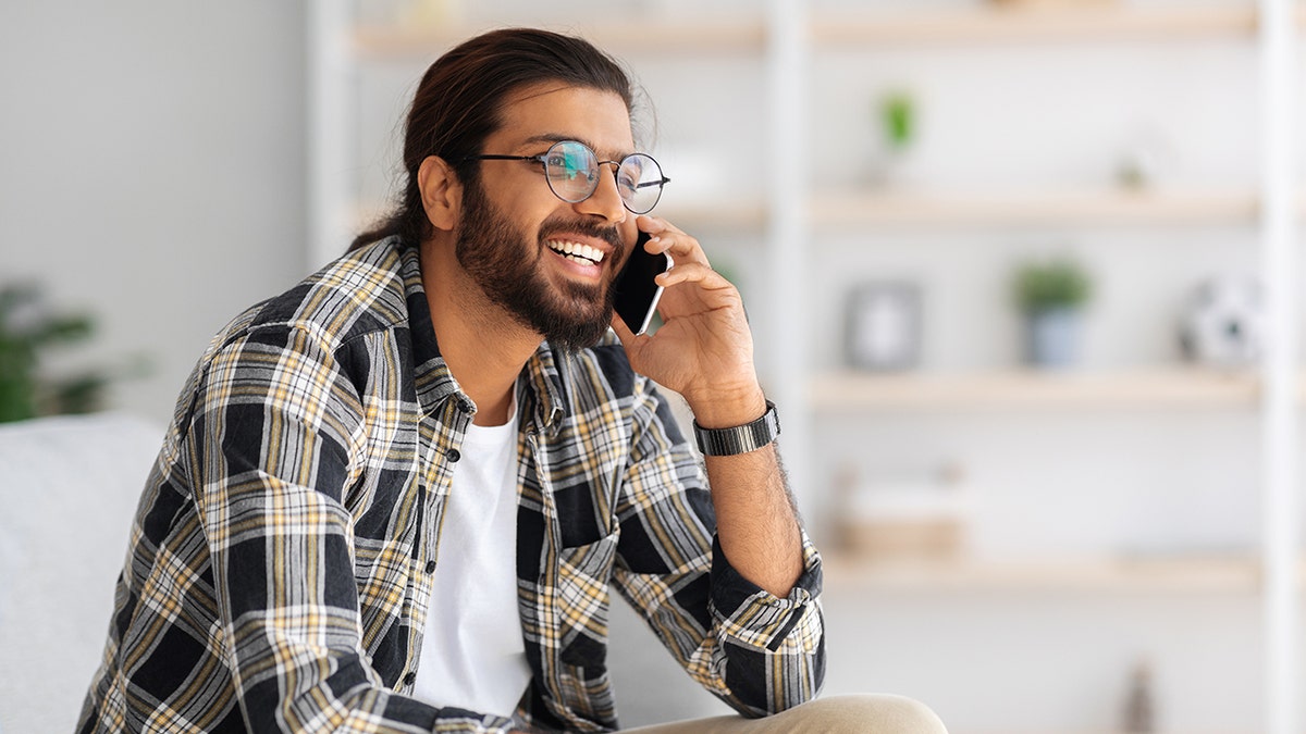 man smiling on phone