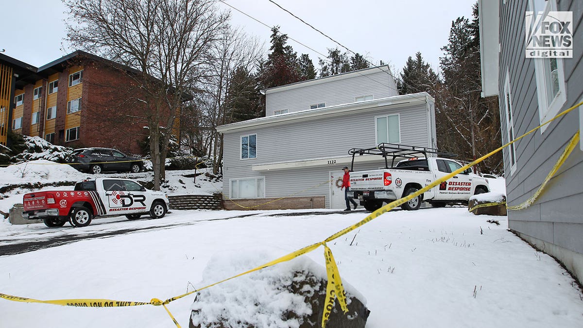 Investigators walk through King Road murder scene