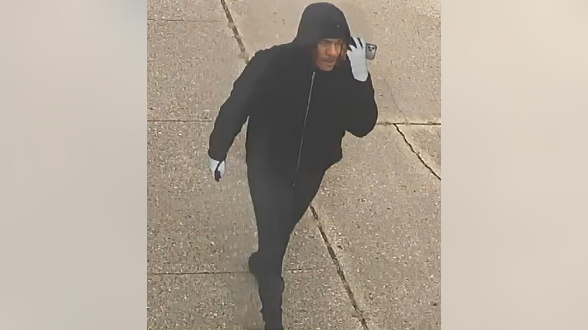 suspect walking with phone
