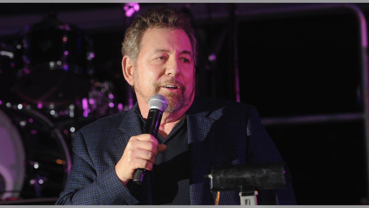 James Dolan speaks at podium