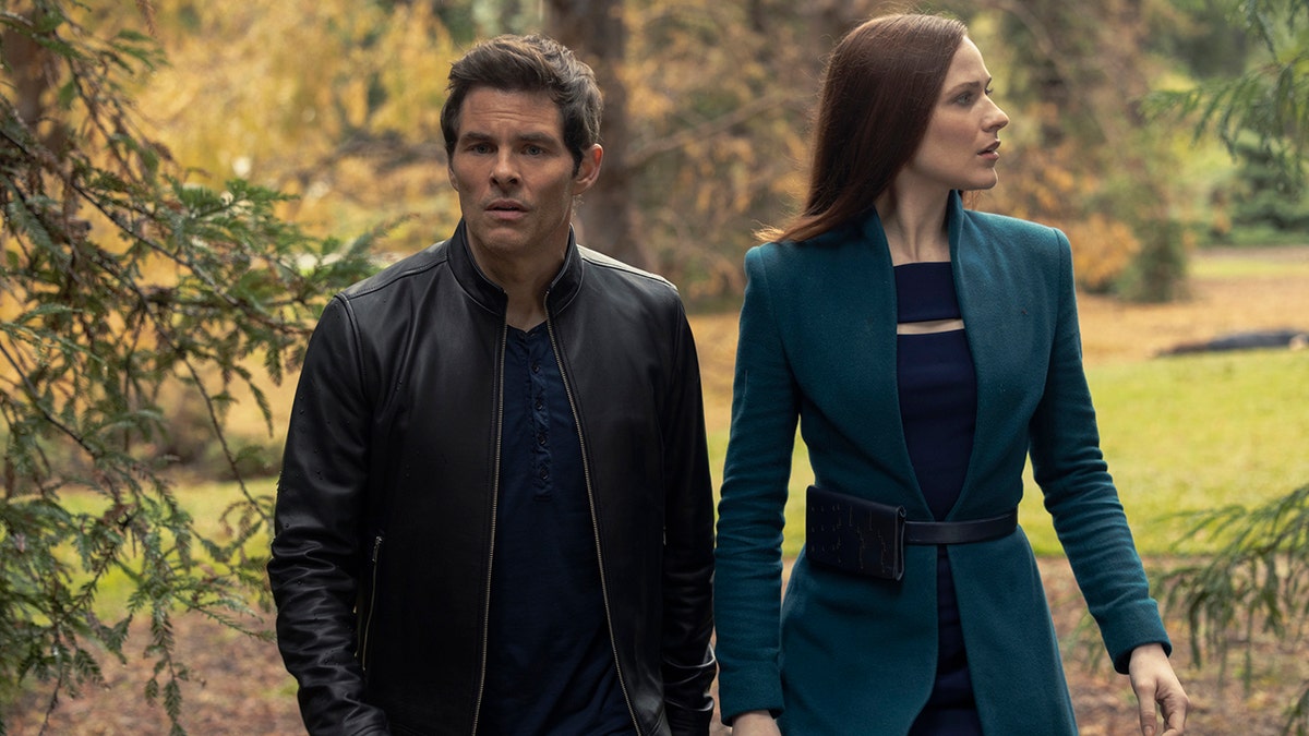James Marsden in a leather jacket as Teddy Flood and Evan Rachel Wood in a turquoise suit jacket as Dolores Abernathy