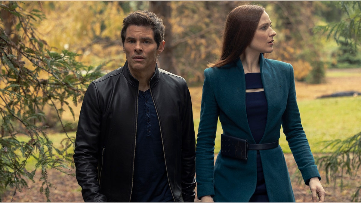 James Marsden in a leather jacket as Teddy Flood and Evan Rachel Wood in a turquoise suit jacket as Dolores Abernathy