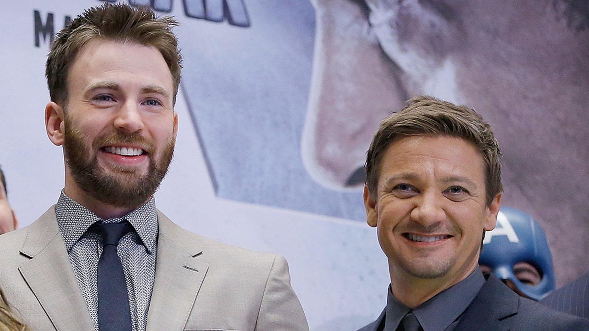 Jeremy Renner and Chris Evans smile in New York