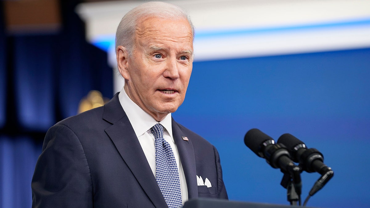 Joe Biden speaking into microphone