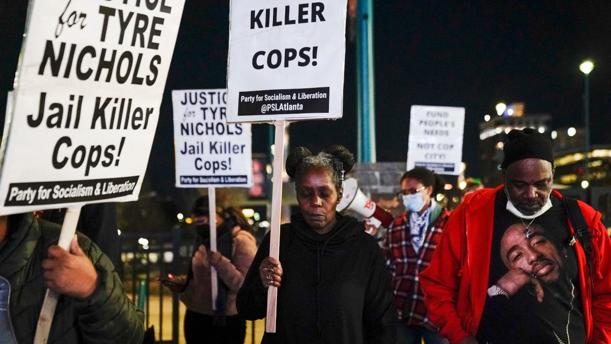 Protesters observe a moment of silence during rally against the fatal police assault of Tyre Nichols, in Atlanta, Georgia, on January 27, 2023