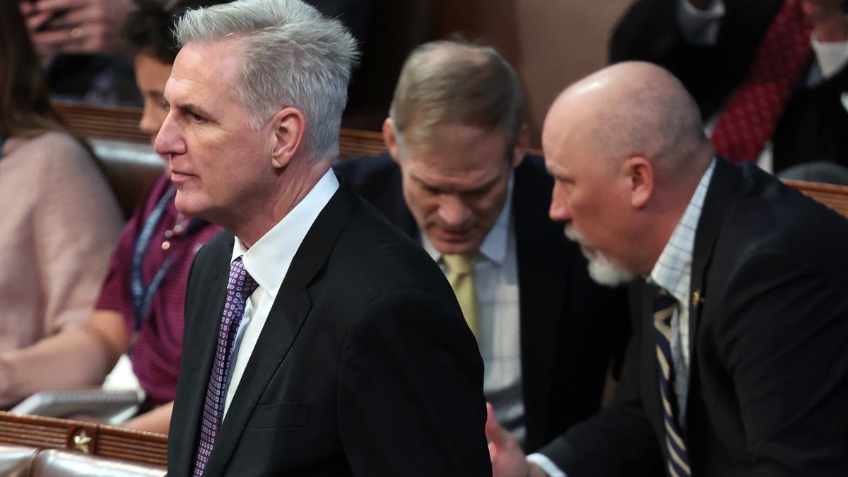 House Republican Leader Kevin McCarthy (R-CA) arrives in the House Chamber for the second day of elections for Speaker of the House as Rep.-elect Jim Jordan (R-OH) (L) talks to Rep.-elect Chip Roy (R-TX) behind him at the U.S. Capitol Building on January 04, 2023 in Washington, DC.