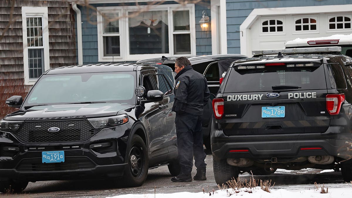 police vehicles parked outside Clancy house